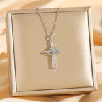 Cross Heart Necklace Set silver pendant displayed on gift box, featuring sparkling crystal cross and intertwined heart centerpiece