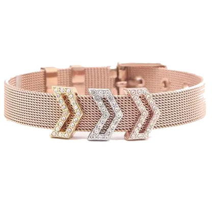 Luxurious rose gold mesh bracelet featuring three crystal-encrusted arrow charms in mixed metal finish