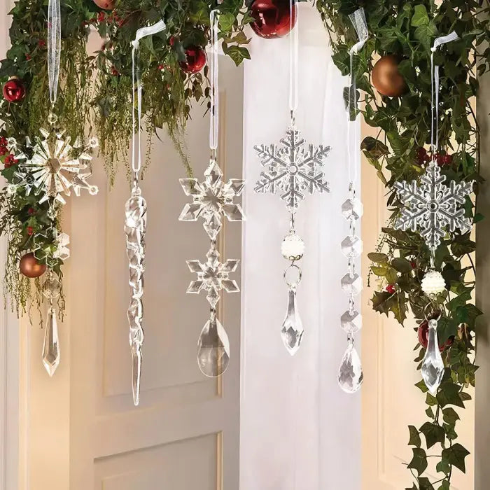 Crystal snowflake garlands hanging with red and gold ornaments among fresh holiday greenery and ivy