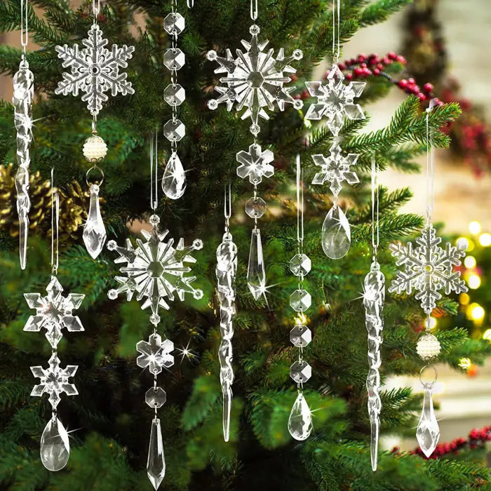 Crystal snowflake and icicle ornaments hanging on Christmas tree with teardrop pendants and geometric patterns