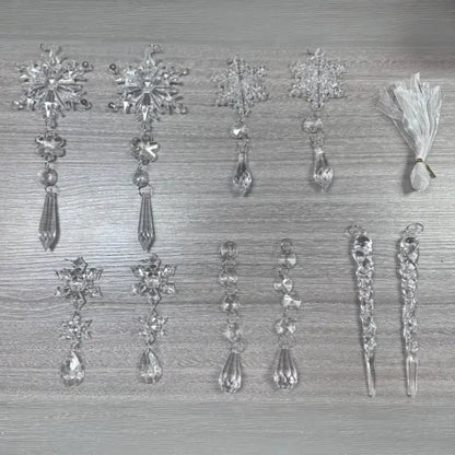  Collection of crystal snowflake ornaments and icicle drops arranged on gray surface showing various designs
