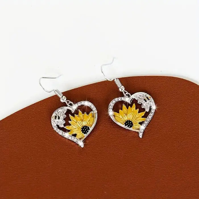 Crystal sunflower heart earrings with bee embellishments, perfect for nature-inspired jewelry styles.