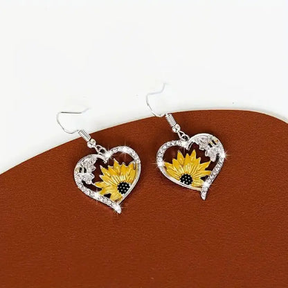 Crystal sunflower heart earrings with bee embellishments, perfect for nature-inspired jewelry styles.