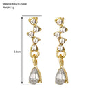 crystal teardrop dangle earrings in gold shown with 2.2cm measurement, delicate rhinestone design for elegant lightweight fashion styling