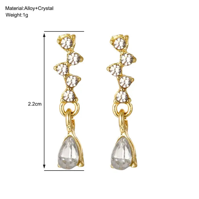 crystal teardrop dangle earrings in gold shown with 2.2cm measurement, delicate rhinestone design for elegant lightweight fashion styling