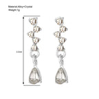 crystal teardrop dangle earrings in silver highlighted with 2.2cm size guide, sparkling dainty accessory ideal for dressy minimal outfits