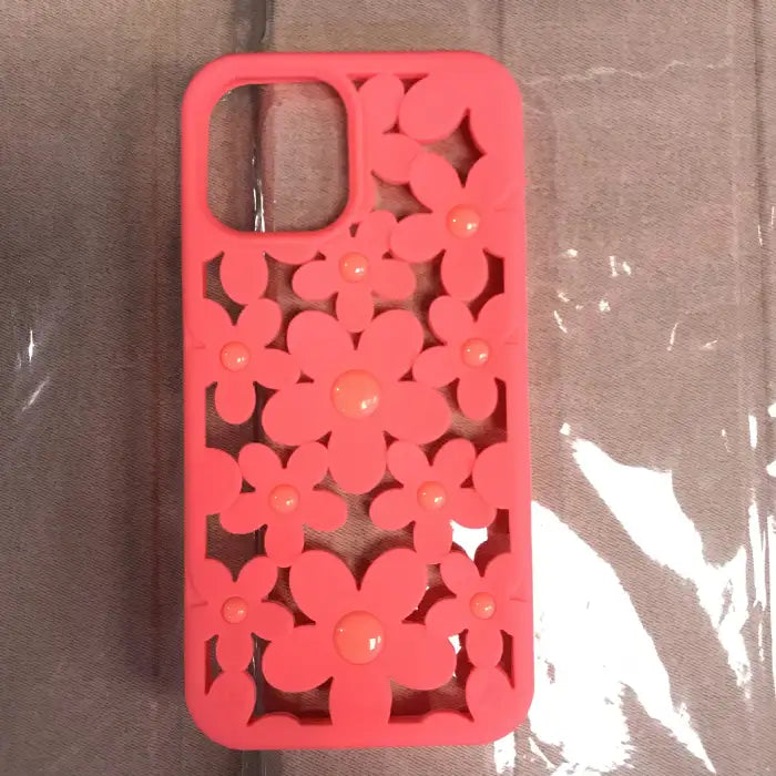 Cute floral iPhone case in mint green and pink variations with 3D flower cutout design shown next to holiday coffee cup