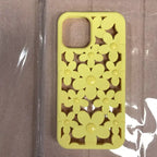 Cute floral iPhone case in soft yellow with 3D daisy cutout pattern featuring matching glossy button centers