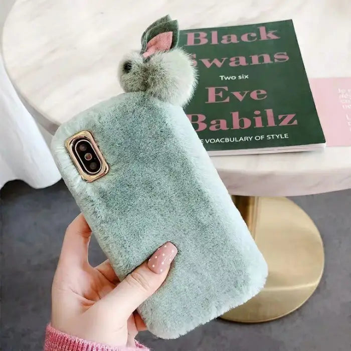 cute fluffy iPhone case in mint green with soft plush texture and 3D bunny ears design.
