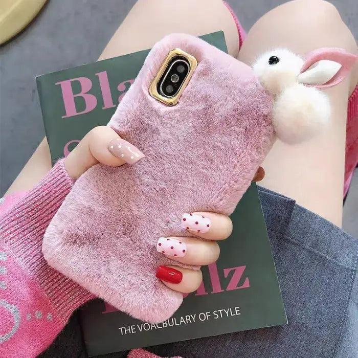 cute fluffy iPhone case in pink with soft plush texture and 3D bunny ears design.