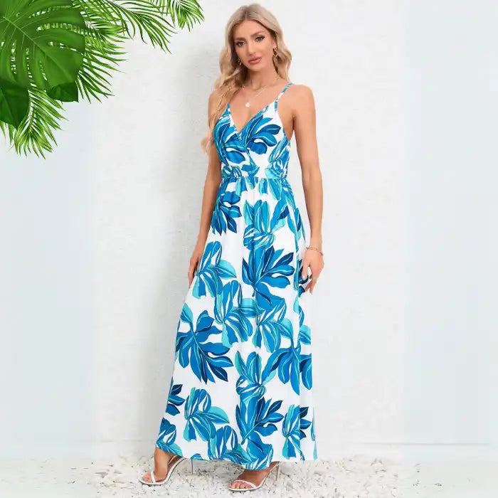 Cute summer dress in royal blue with tropical leaf pattern, v-neck wrap bodice and spaghetti straps ideal for beach getaways
