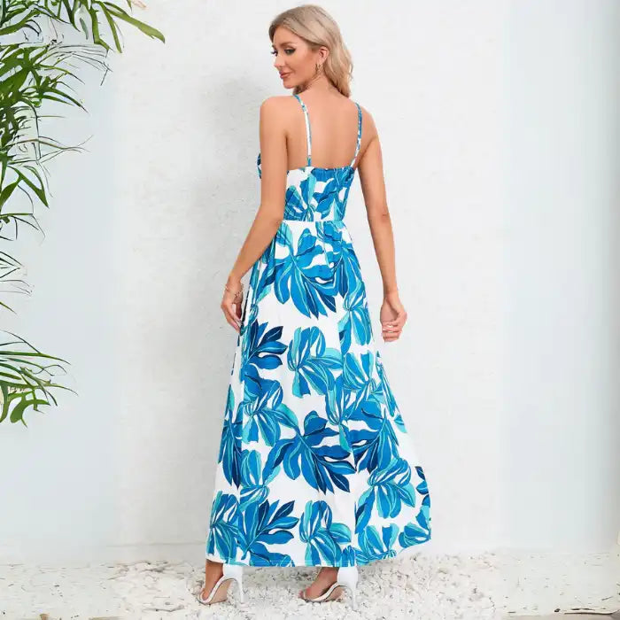 Cute summer dress featuring back view of blue leaf pattern on white background with adjustable spaghetti straps