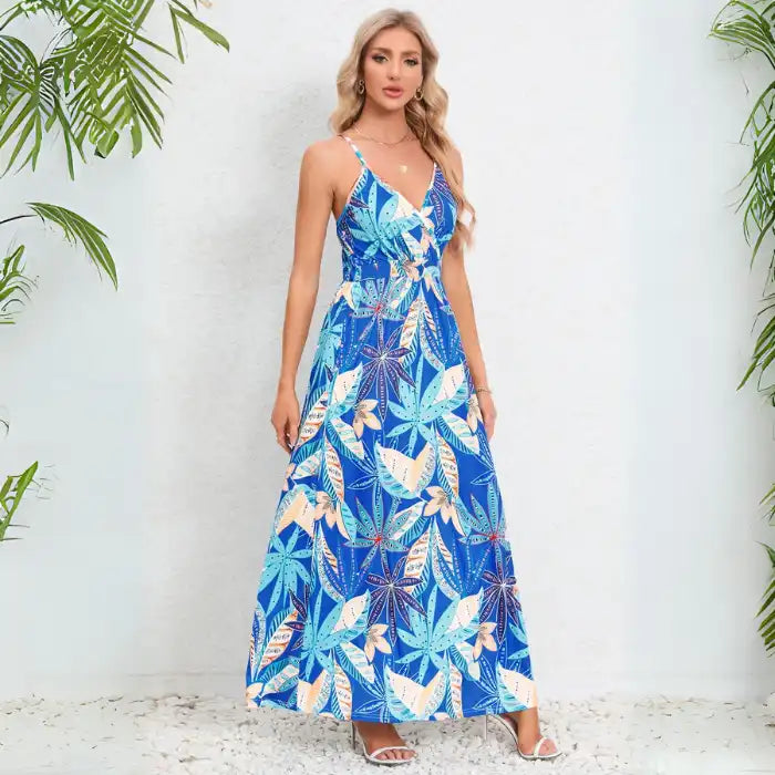 Cute summer dress in detailed view of blue and brown floral print on white background with v-neck wrap bodice design