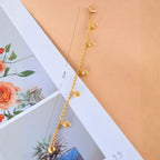 dainty gold heart chain bracelet shown extended with measurement detail, featuring multiple heart charms for a delicate minimalist look