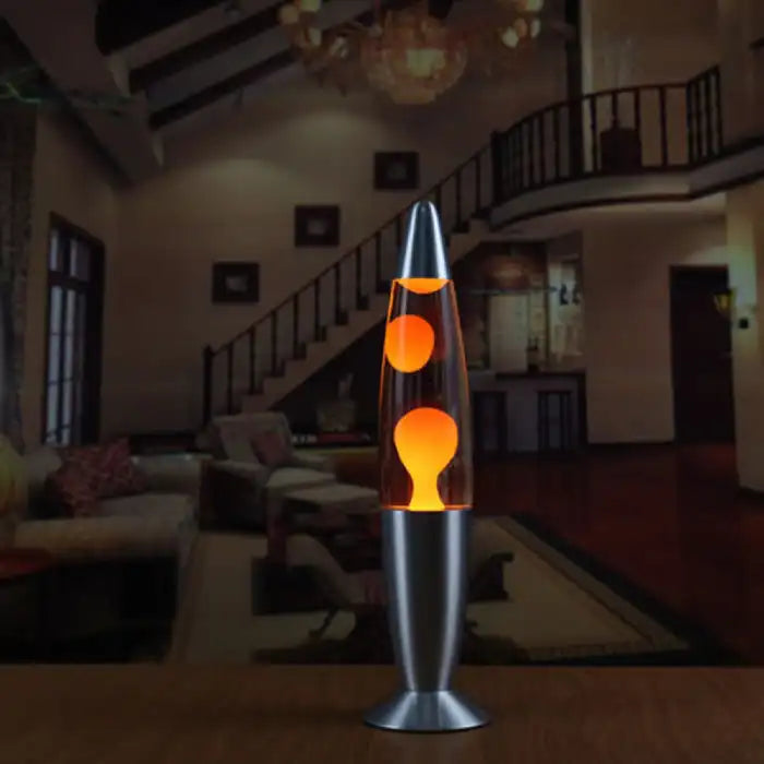Decorative wax lamp with orange wax glowing in a cozy living room setting with warm lighting.