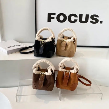 Four mini bucket bags in black, beige, brown, and tan arranged on clear display with FOCUS text background