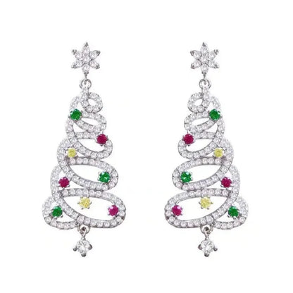 Sparkling Christmas tree earrings with diamonds and colorful gemstones for festive jewelry inspiration.