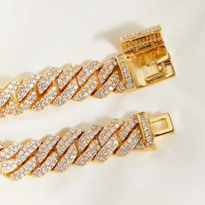 Close-up of a gold bracelet with diamond-encrusted links and a secure clasp for elegant jewelry design.