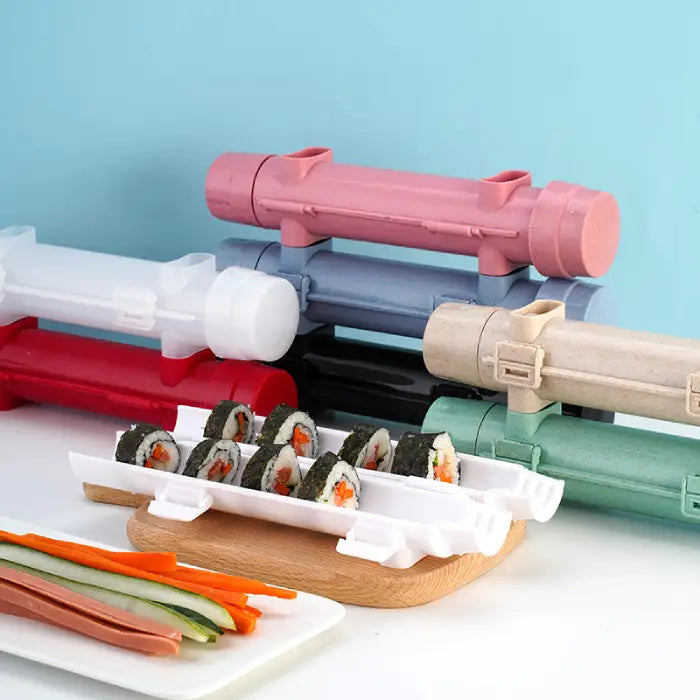 DIY sushi rolling tools in various colors displayed with prepared sushi and fresh vegetable slices.