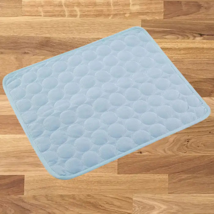 dog cooling mat in light blue featuring soft quilted texture with matching edging perfect for summer heat relief