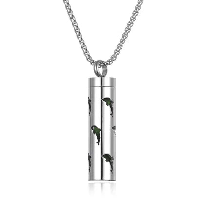 Dolphin cutout aromatherapy pendant with green accents, crafted from stainless steel for essential oils.