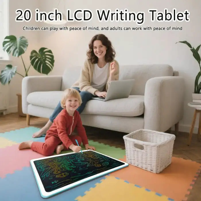 Drawing tablet on floor with young child drawing while mom works on laptop in living room.