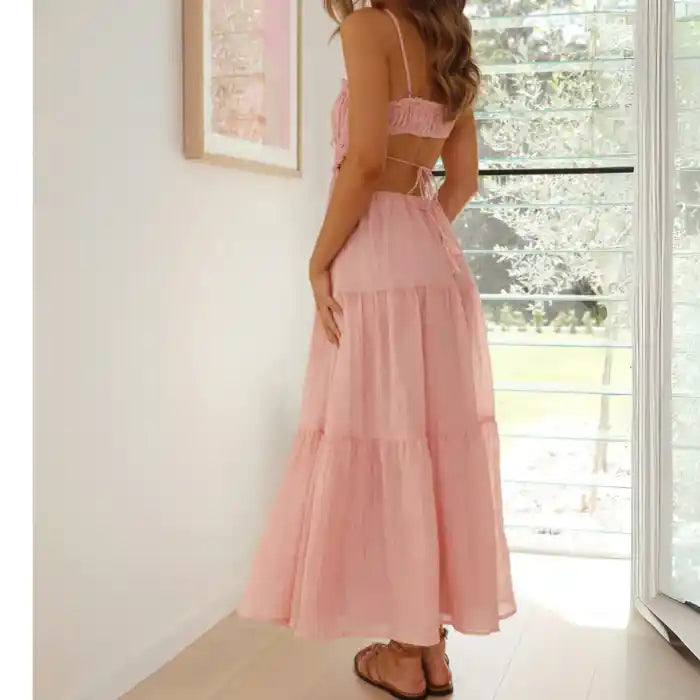 Dress in pink with open back tie, tiered layers and a relaxed fit ideal for casual summer