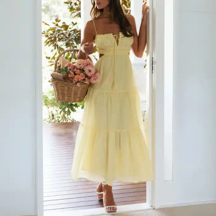  Dress in pastel yellow with tiered skirt, flowy fit, and lightweight fabric for sunny days
