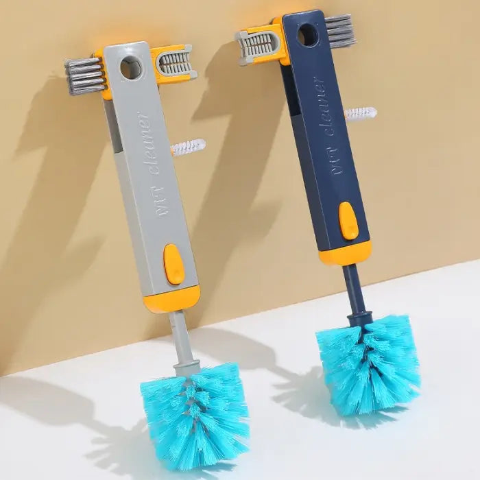  Side-by-side comparison of navy and gray cleaning brushes with turquoise bristles against beige background