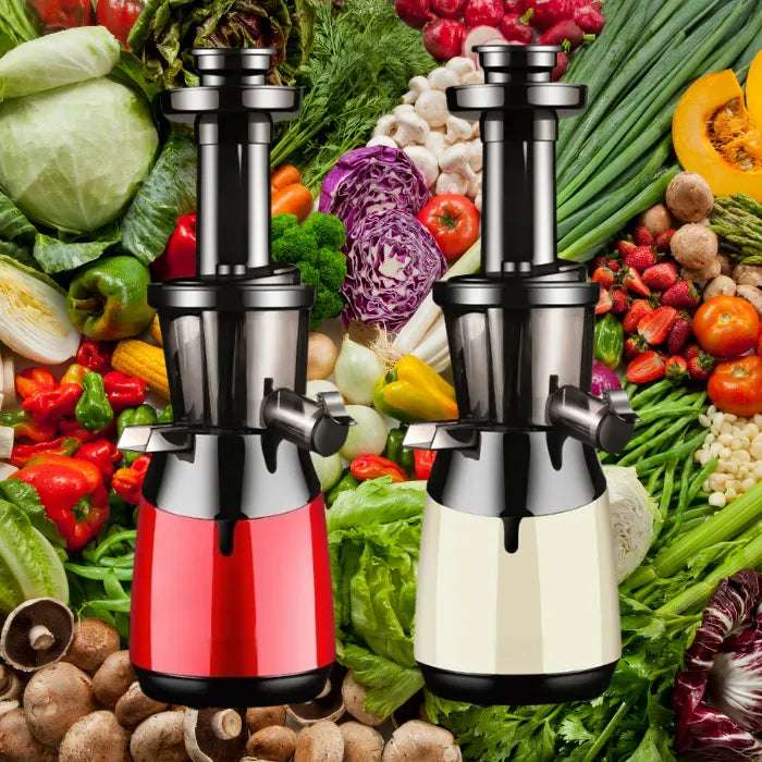 Modern slow juicers in red and cream colors displayed with fresh vegetables and fruits for healthy juice extraction