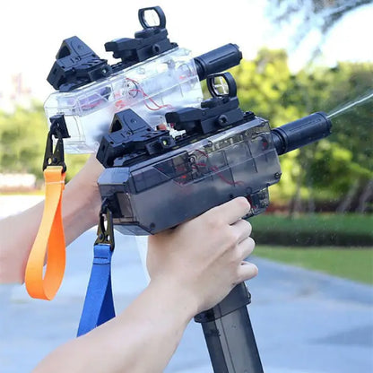 Two water guns in action, one clear and one black, with orange and blue straps for outdoor fun.