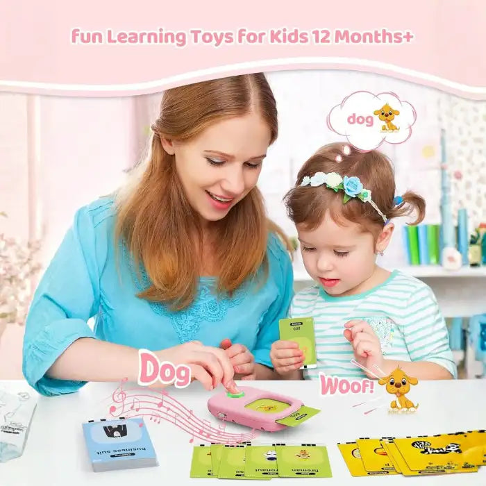 Educational flashcard reader used by mom and daughter to learn animal names like dog and cat together.