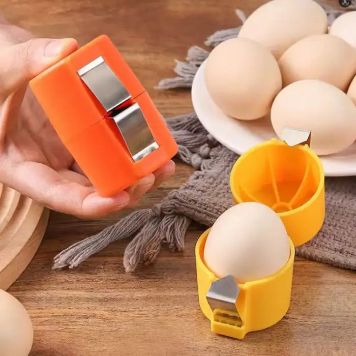 Hand using egg shell opener with fresh eggs nearby on wooden surface showing simple one-hand operation.