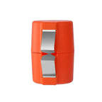 Compact orange egg shell opener in closed position with dual cutting blades for easy egg cracking.