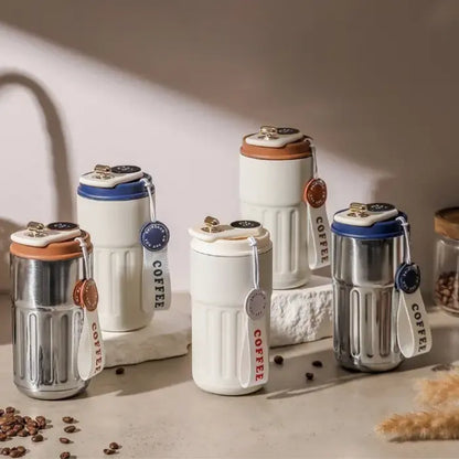 Collection of smart coffee mugs with digital displays in various colors on wooden surface with coffee beans