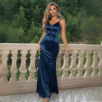 Elegant navy blue satin prom gown with a fitted silhouette, V-neckline, and spaghetti straps.
