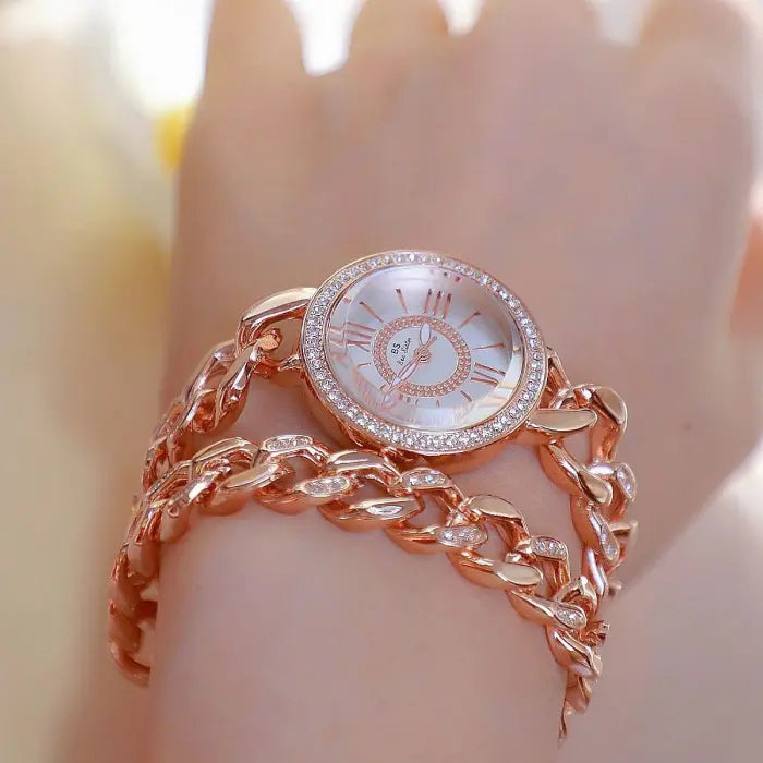 Stylish rose gold chain watch with sparkling crystal accents for a luxury women's accessory look.