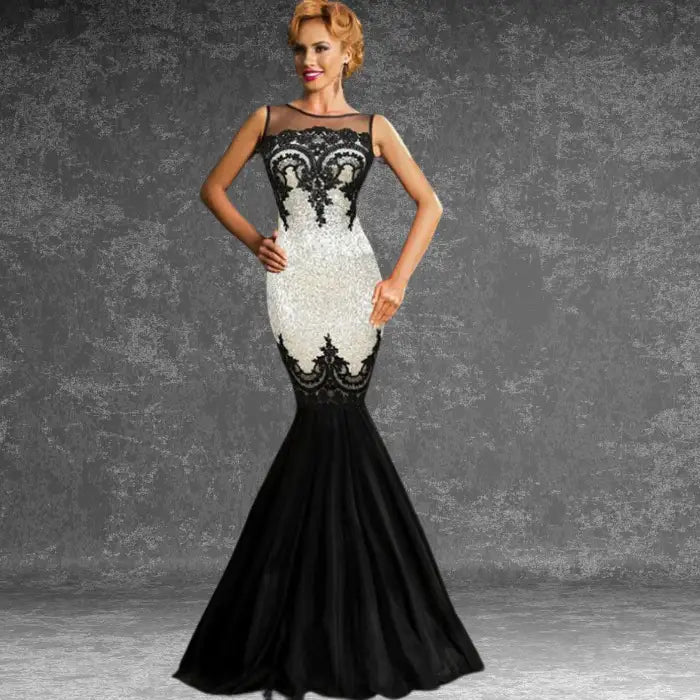 Model wearing elegant white and black sequin mermaid dress with lace detail, perfect for galas or formal events.