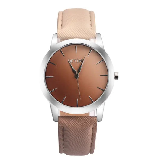 Minimalist women's watch with silver case, brown gradient dial, and beige textured leather strap