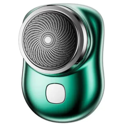 Elegant green electric shaver with circular patterned head, smooth body, and white button on glossy surface