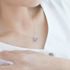 Evil eye protection necklace with blue stone pendant worn on woman’s neck for elegant everyday style.