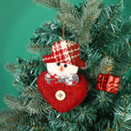 fabric pendant santa claus heart shaped snowman ornament hanging on christmas tree with red gift box