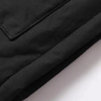 Faux fur hooded winter parka jacket fabric closeup, showing durable water resistant shell material.