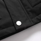 Faux fur hooded winter parka jacket pocket detail, featuring metal snap closure on utility flap.