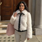 Faux fur jacket in soft blush with zip front and plush texture, styled for winter warmth and chic everyday outfits