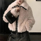 Faux fur jacket in soft blush with zip front and plush texture, styled for winter warmth and chic everyday outfits