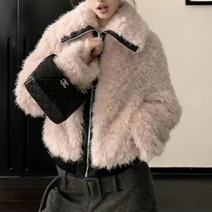 Faux fur jacket in soft blush with zip front and plush texture, styled for winter warmth and chic everyday outfits