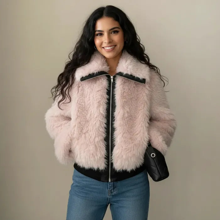 Faux fur jacket in soft blush with zip front and plush texture, styled for winter warmth and chic everyday outfits