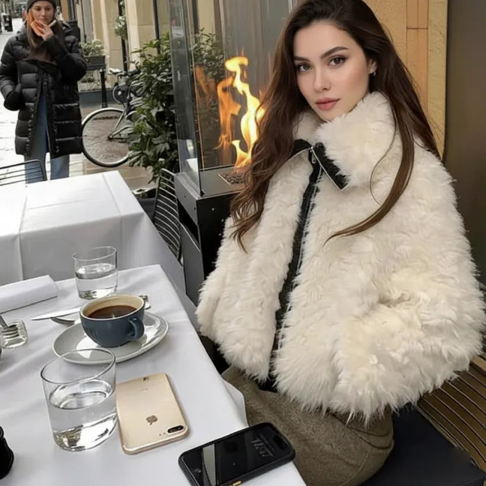 Faux fur jacket in soft blush with zip front and plush texture, styled for winter warmth and chic everyday outfits