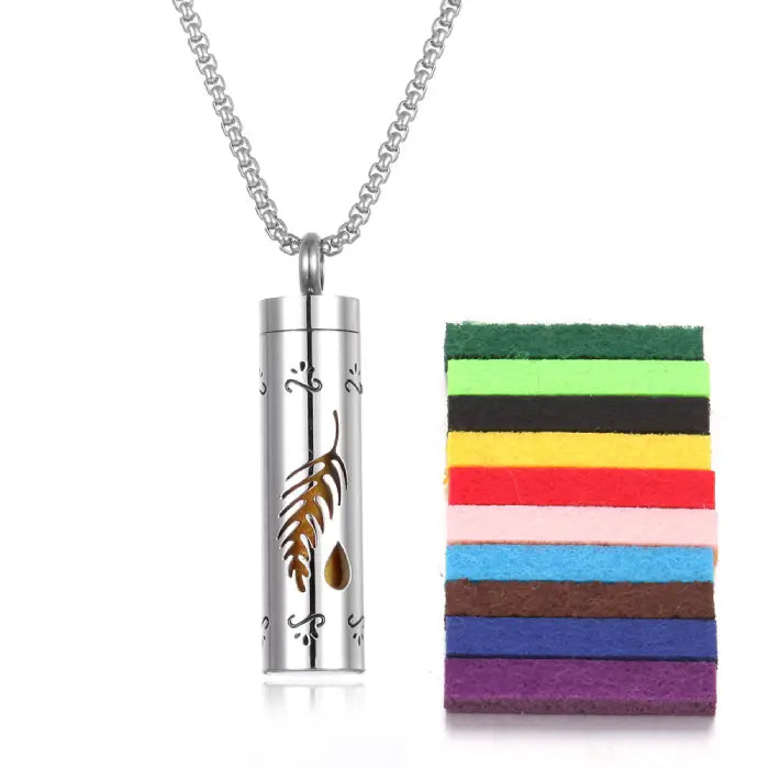 Feather drop design stainless steel aromatherapy pendant with colorful felt pads for essential oil use.